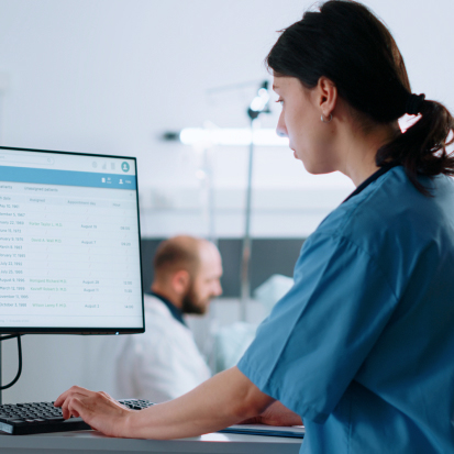 Doctor uses patient care management software for diagnistics and healing
